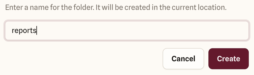 New folder dialog with reports typed as the folder name, the note that it will be created in the current location, and Cancel and Create buttons.